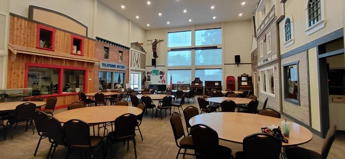 The Great Hall arranged with round tables and open event space