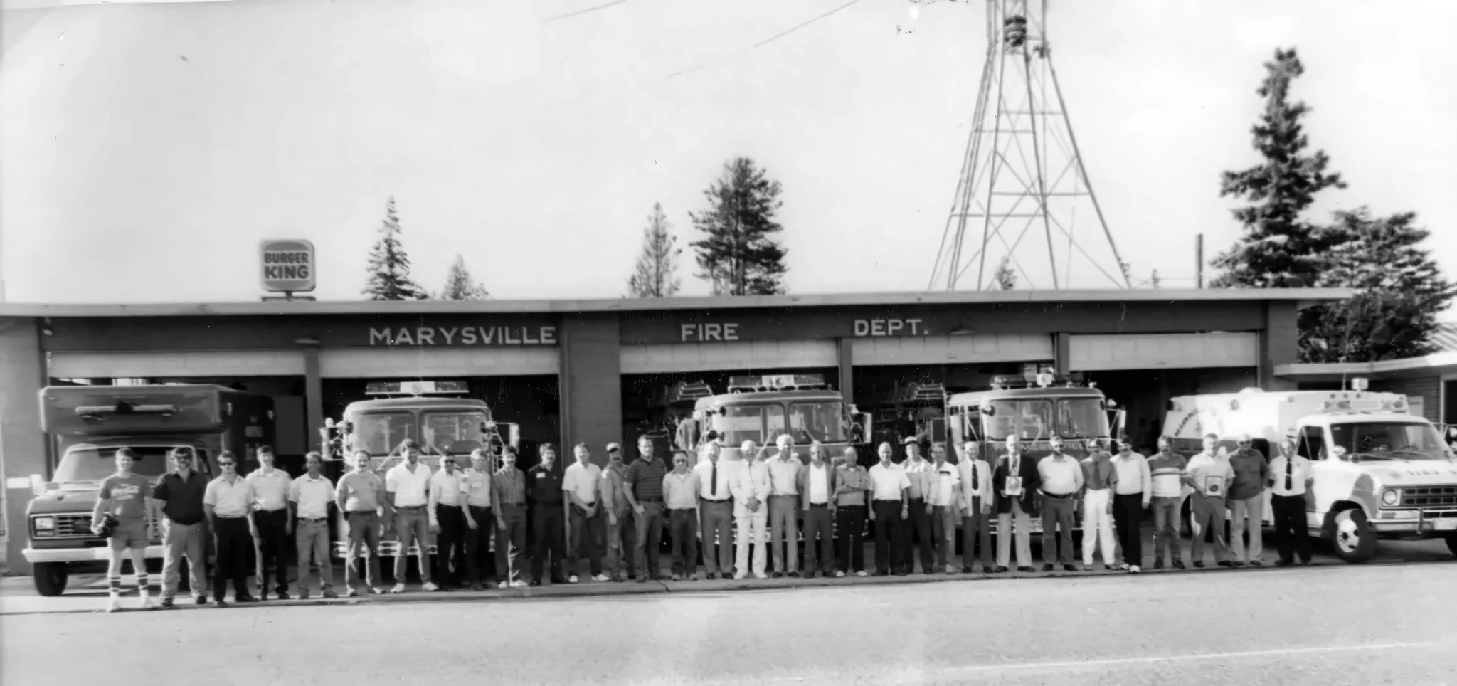 Marysville Fire Department members lined up with fire engines in front of the station