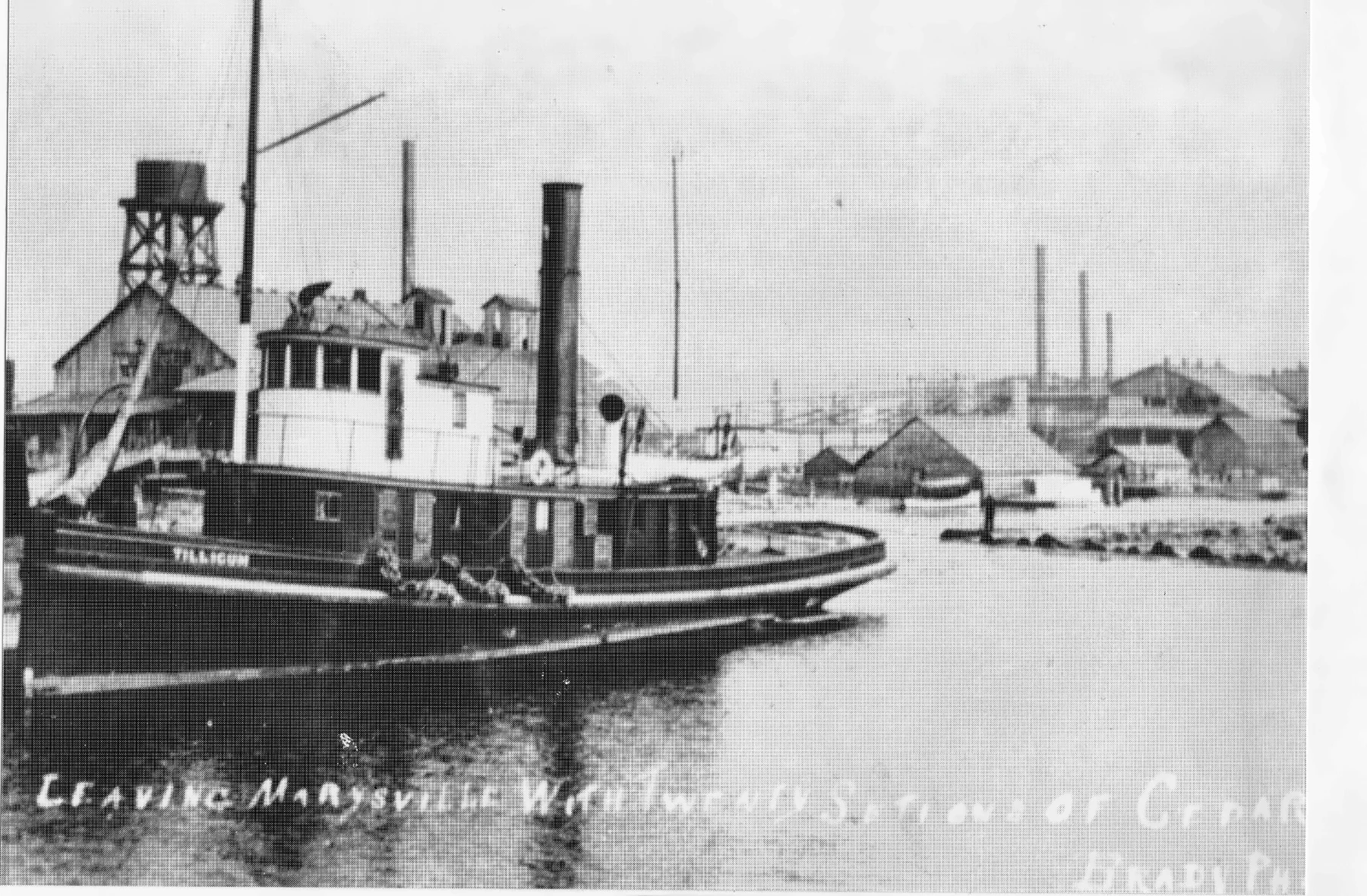 Tug Tillicum on Ebey Slough beside Marysville's historic waterfront industries